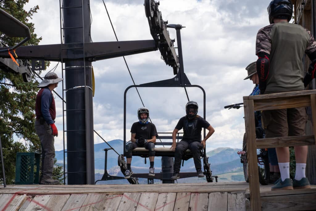 Family of bikers loading onto lift at Pajarito